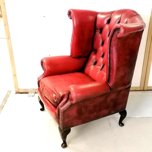 241 - Vintage red leather wing armchair with wear to the leather and a tear to the top at the back - 81cm ... 