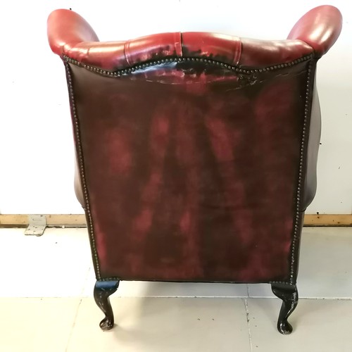 241 - Vintage red leather wing armchair with wear to the leather and a tear to the top at the back - 81cm ... 