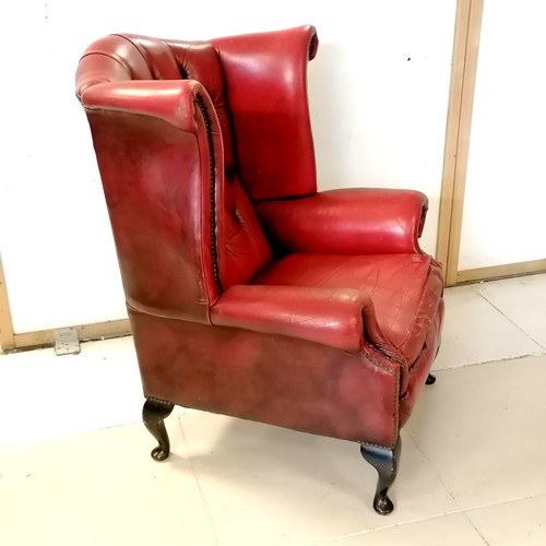 241 - Vintage red leather wing armchair with wear to the leather and a tear to the top at the back - 81cm ... 