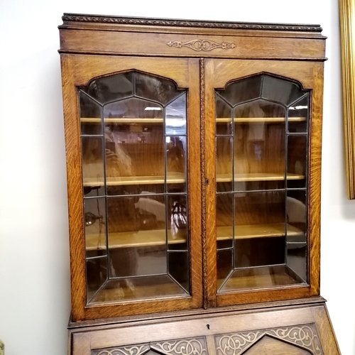 261 - Oak bureau bookcase with leaded glass doors with original key- has 1 handle missing - 90cm long x 44... 