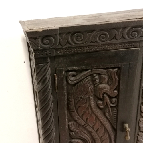 309 - Continental 2 door carved oak wall cabinet depicting sea creatures - 70cm long x 20cm deep x 62cm hi... 