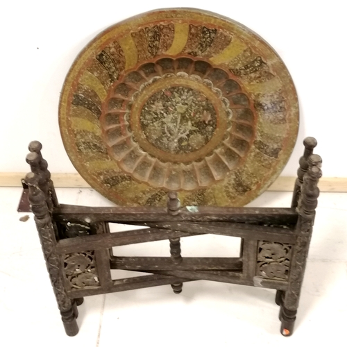 318 - Indian Benares folding table with brass circular top and pierced decorated base - 59cm deep x 53cm h... 