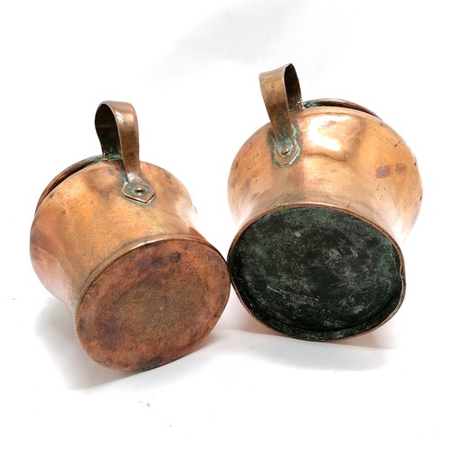 325 - 2 x antique copper measures (?) - largest (20cm high x 17cm diameter top) has XXXXIIII engraved on h... 