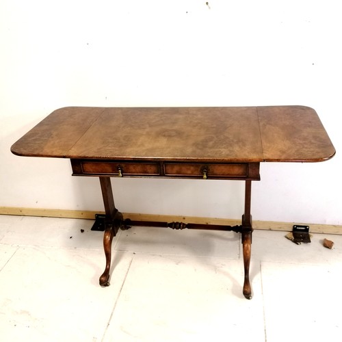 371 - Antique reproduction walnut sofa table with stretcher base and pad feet with brass castors, has reta... 