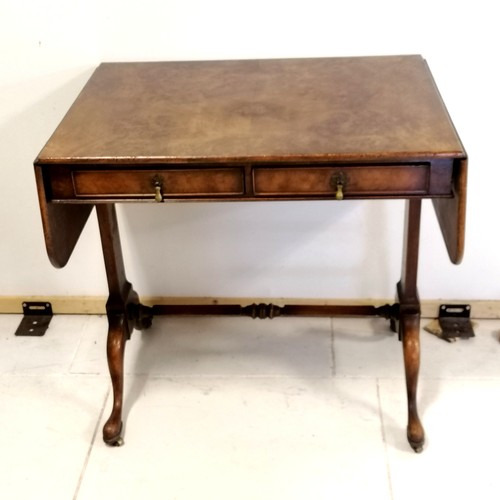 371 - Antique reproduction walnut sofa table with stretcher base and pad feet with brass castors, has reta... 