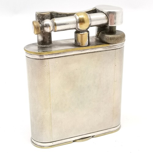 394 - Dunhill antique table lighter with lift up arm - 10.4cm high & PATENT 390107