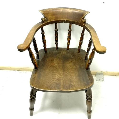 428 - Antique elm captains chair 80cm high - has a small split to the seat