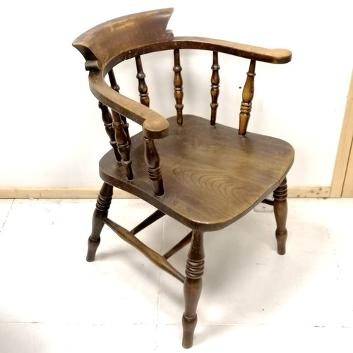 428 - Antique elm captains chair 80cm high - has a small split to the seat