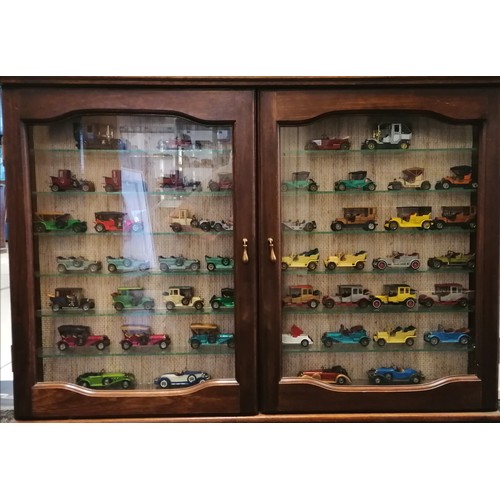 461 - Double wooden display cabinet containing 47 models of cars - 65cm x 93cm x 10cm