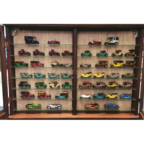 461 - Double wooden display cabinet containing 47 models of cars - 65cm x 93cm x 10cm