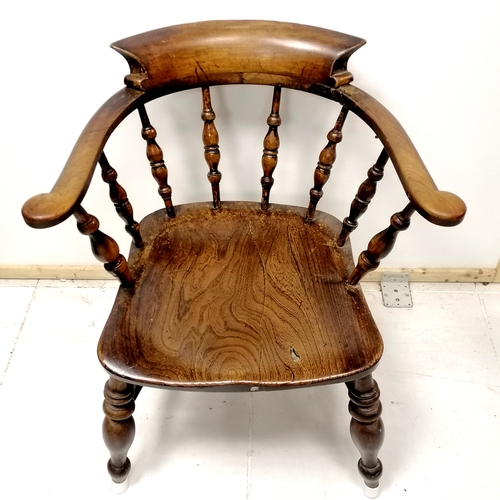 472 - Antique elm captains chair 77cm high - has an old repair to the back and has old crack to seat