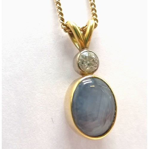 412 - Star sapphire & diamond set 2cm drop pendant in unmarked gold (touch tests as 18ct) on an UnoAErre I... 