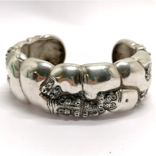 427 - Patrick Mavros (Zimbabwe) silver hippo cuff bangle - 68mm across & 68g RRP £550 - has signs of use b... 