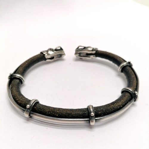 432 - Viking silver & leather bangle with dragon head detail - 9cm across & 29g total weight