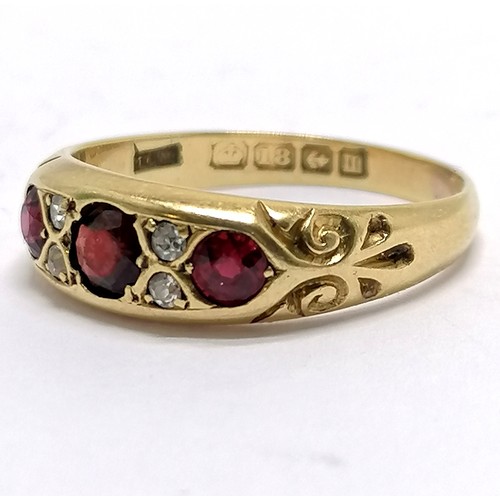 440 - Antique 18ct hallmarked gold ruby / diamond set ring - size R & 4.6g total weight ~ centre stone has... 