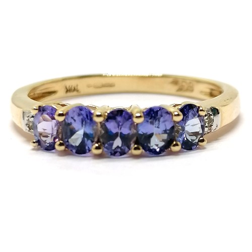 553 - 14ct hallmarked gold tanzanite (5) / diamond (2) stone set ring - size Q & 2.3g total weight