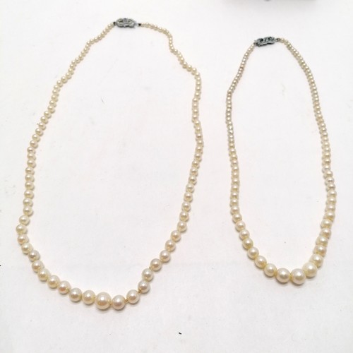 558 - 2 x vintage graduated pearl necklaces - longest 50cm in a vintage box