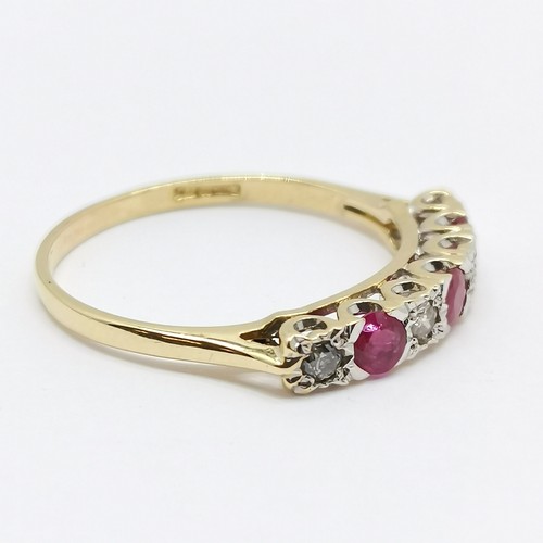 585 - 18ct hallmarked gold ruby (3) & diamond (4) stone set ring - size T & 2.7g total weight