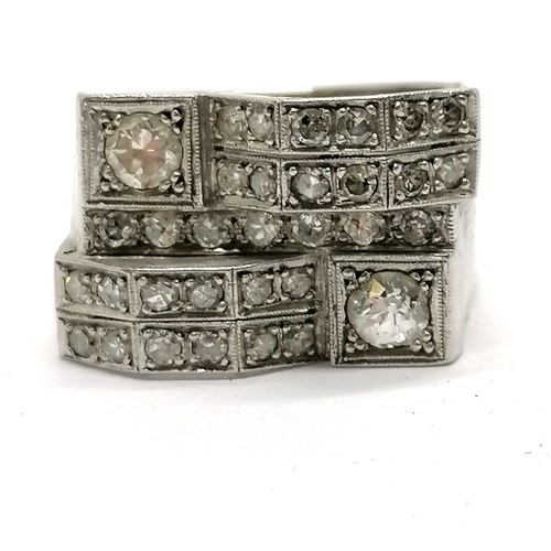 586 - Art Deco diamond set unmarked white metal ring - size M & 6.7g total weight ~ has slight distortion ... 