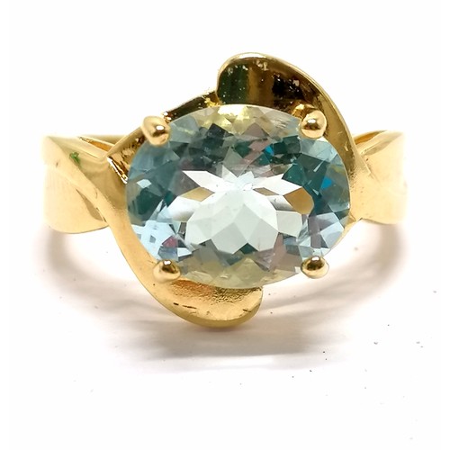 590 - 18ct hallmarked gold aquamarine in fancy mount ring - size N & 5.6g total weight