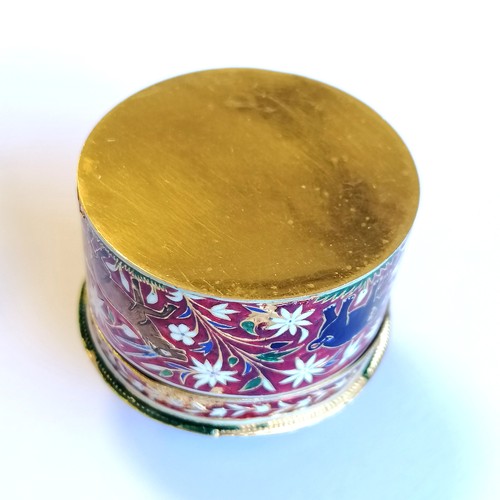 592 - Unmarked high carat gold (touch tests as 22ct) circular lidded box with large cabochon emerald (appr... 