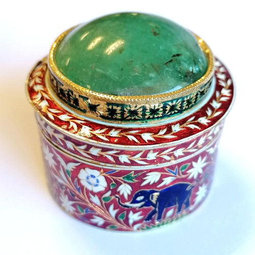 592 - Unmarked high carat gold (touch tests as 22ct) circular lidded box with large cabochon emerald (appr... 