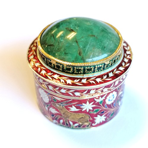 592 - Unmarked high carat gold (touch tests as 22ct) circular lidded box with large cabochon emerald (appr... 