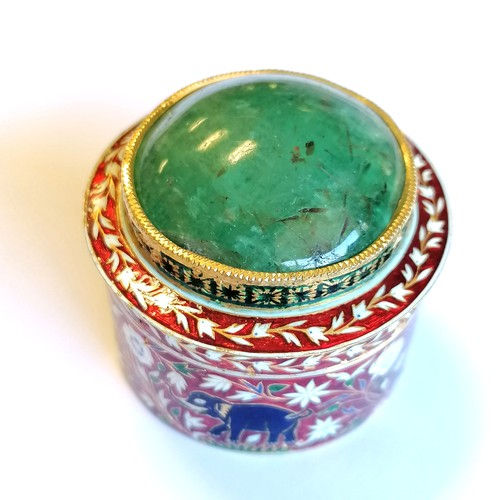 592 - Unmarked high carat gold (touch tests as 22ct) circular lidded box with large cabochon emerald (appr... 