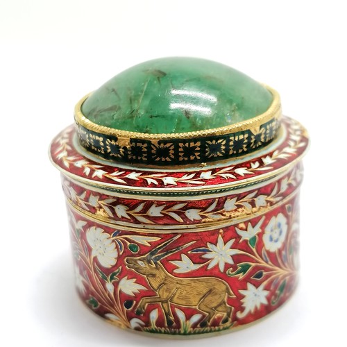 592 - Unmarked high carat gold (touch tests as 22ct) circular lidded box with large cabochon emerald (appr... 