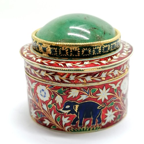 592 - Unmarked high carat gold (touch tests as 22ct) circular lidded box with large cabochon emerald (appr... 