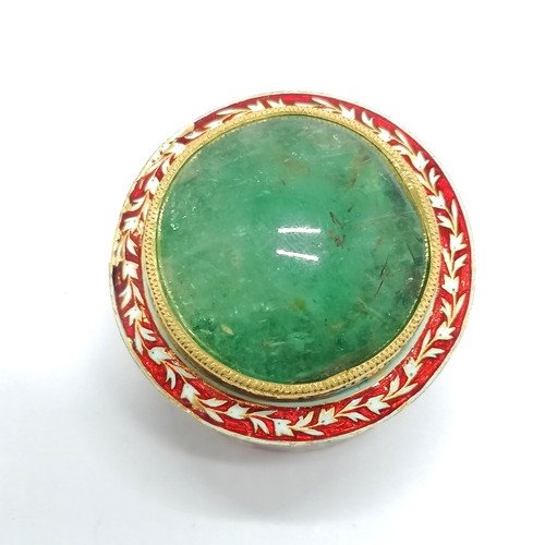 592 - Unmarked high carat gold (touch tests as 22ct) circular lidded box with large cabochon emerald (appr... 