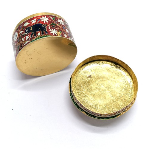 592 - Unmarked high carat gold (touch tests as 22ct) circular lidded box with large cabochon emerald (appr... 