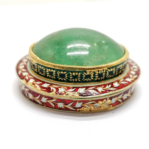 592 - Unmarked high carat gold (touch tests as 22ct) circular lidded box with large cabochon emerald (appr... 