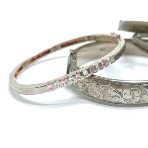 618 - 4 x silver marked bangles - 1 set with pink / white stone (6cm across) - total weight (4) 57g - SOLD... 