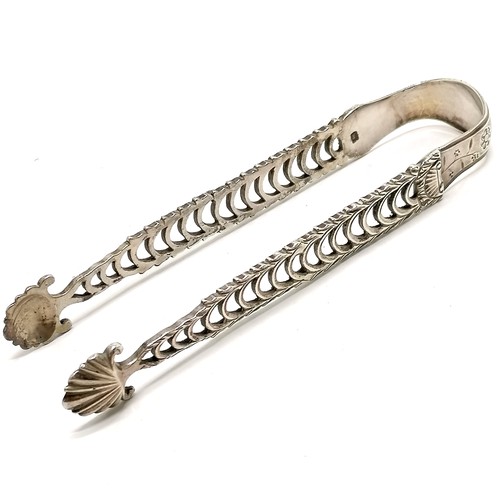 673 - 18th century unusual silver tongs with open work arms and shell bowls by Richard Mills - 14cm long &... 