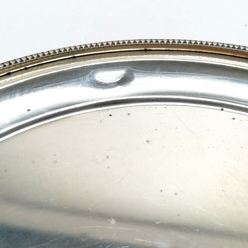 700 - 1973 silver salver with cast beaded edge detail terminating on 3 ball and claw feet by L.P. - 20.5cm... 