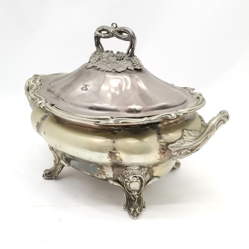 711 - Large EPNS 2 handled lidded tureen in Rococo style on 4 feet with grape detail to handle (28cm high ... 