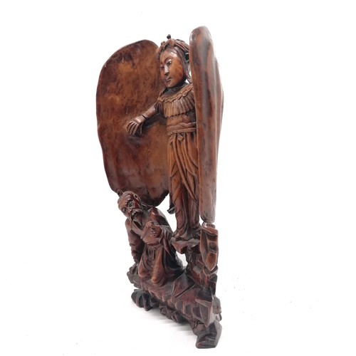 29 - Oriental antique hand carved depiction of a winged figure with kneeling figure at feet - 42cm high ~... 