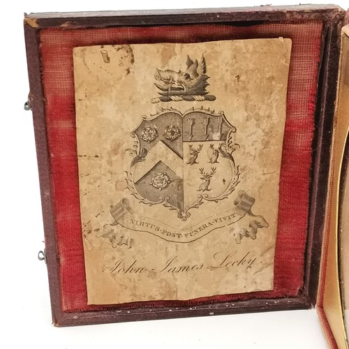 78 - Antique silhouette of a lady in original fitted case with inset coat of arms / crest for John James ... 