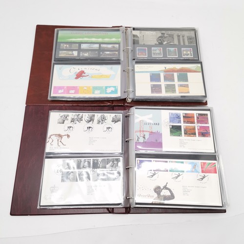 131 - 2 x Royal Mail albums i) presentation packs FV £125+ ii) @90 x FDC's 1998-2006