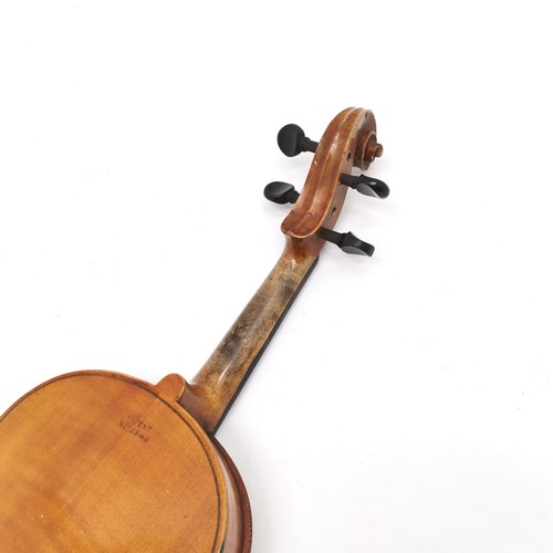 167 - An early 20th century Stainer violin patent number 23140 60cm total length, with bow and in an antiq... 