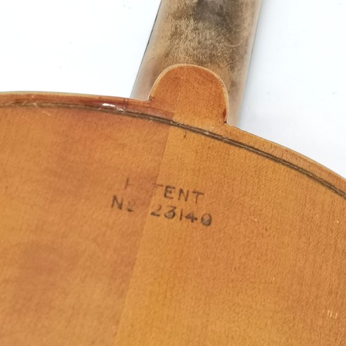 167 - An early 20th century Stainer violin patent number 23140 60cm total length, with bow and in an antiq... 