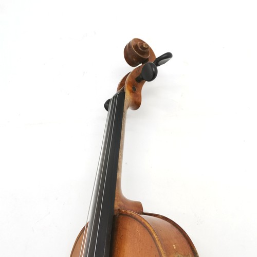 167 - An early 20th century Stainer violin patent number 23140 60cm total length, with bow and in an antiq... 