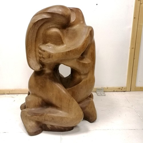 175 - Large scale wooden sculpture of a kiss monogrammed E M B dated 1974 - 85cm high x 50cm across