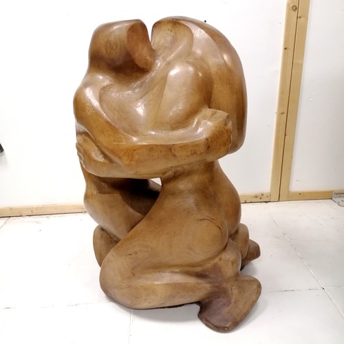 175 - Large scale wooden sculpture of a kiss monogrammed E M B dated 1974 - 85cm high x 50cm across