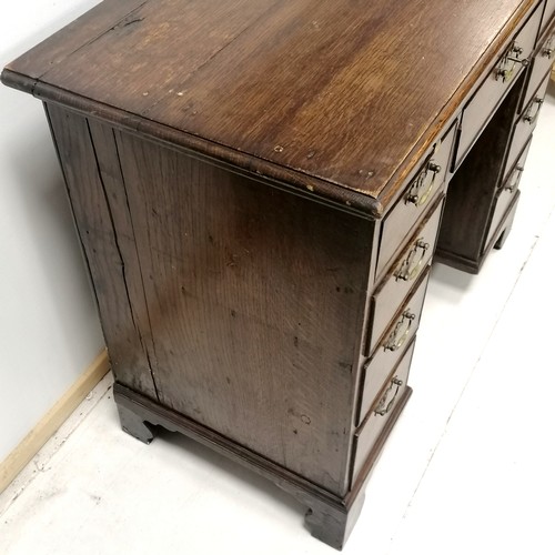 178 - Antique oak small kneehole desk on bracket feet with a brush slide 94cm long x 68cm high x 48cm wide... 