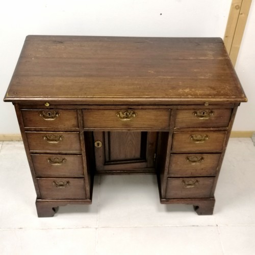 178 - Antique oak small kneehole desk on bracket feet with a brush slide 94cm long x 68cm high x 48cm wide... 