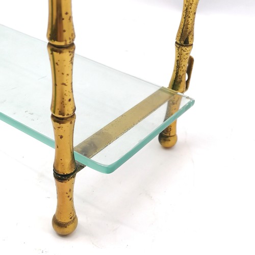 179 - Decorative gilt metal and glass wall shelf 85cm high x 54 cm wide x 14cm deep - some discolouration ... 