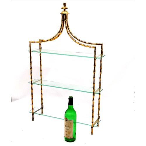 179 - Decorative gilt metal and glass wall shelf 85cm high x 54 cm wide x 14cm deep - some discolouration ... 