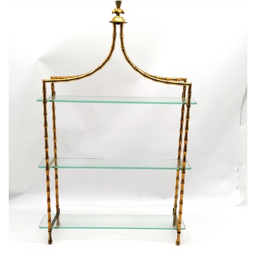 179 - Decorative gilt metal and glass wall shelf 85cm high x 54 cm wide x 14cm deep - some discolouration ... 